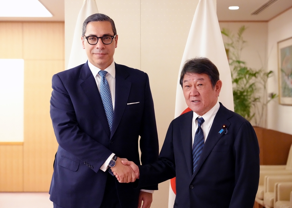 Foreign Minister MOTEGI shaking hands with H.E. Dr. Constantinos Kombos, Minister of Foreign Affairs of Cyprus