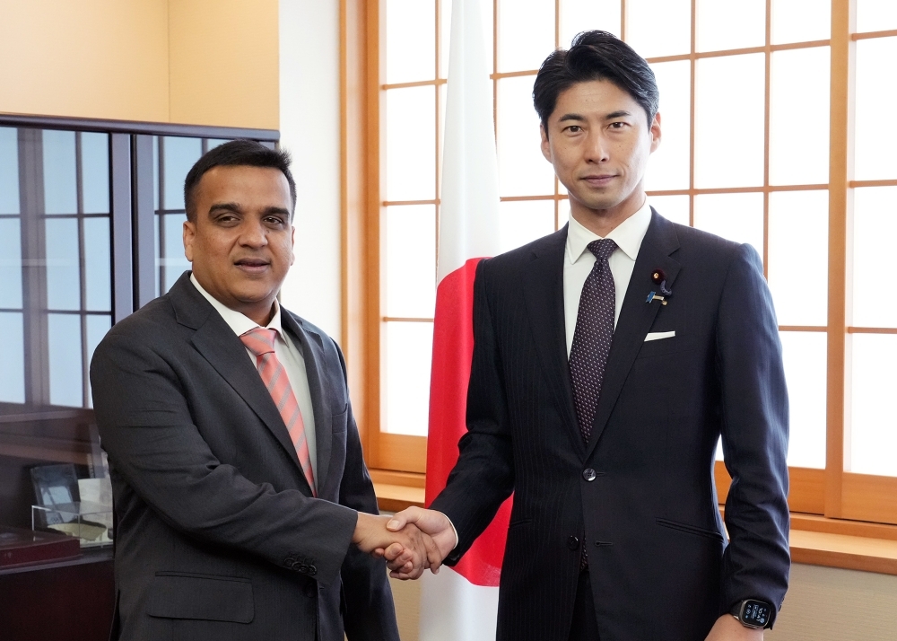 State Minister NAKASONE shaking hands with Mr. Harsh Sanghavi, Deputy Chief Minister of Gujarat, India