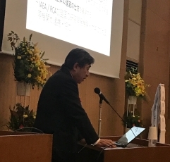 (写真2)講演を行う中野隆史RCA政府代表