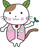 （画像2）「草の根無償」イメージキャラクター「くさのネコ」2017年に誕生。手に草を持ち，世界中の人々に笑顔を届ける