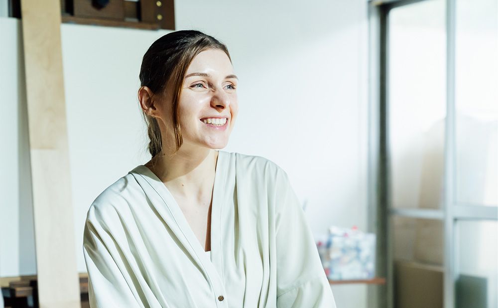 Adeline talking with a smile