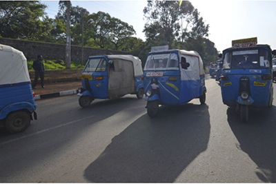 A photo of motor tricycle taxis in the city (Ethiopia)