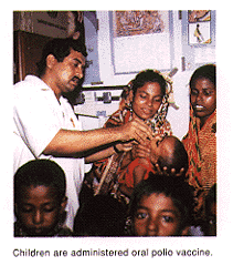 Photo (Children are administered oral polio vaccine)