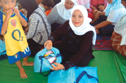 Women receiving hygiene kits