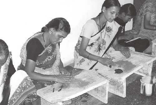 Women being trained in the manufacture of incense sticks (Source: LIFE)