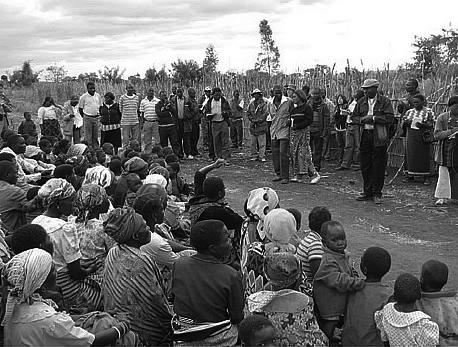 Mr. Nkhoma (far right) giving an explanation to farmers