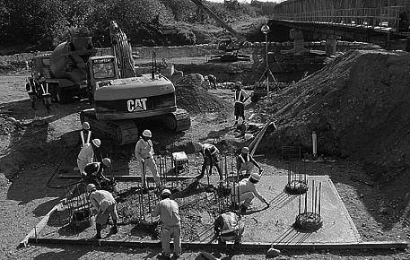 Workers carrying out construction of a foundation.