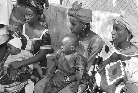 Mothers and children waiting for medical examinations (Photo: Raymond Wilkinson/JICA)