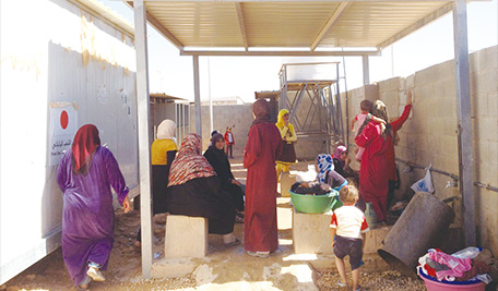 WASH committee members during an informal meeting at a washroom facility. (Photo: JEN)
