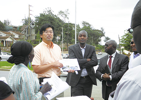 Local engineers (front) and Mr. Nishibayashi explain the importance of road maintenance to local media. (Photo: Motohiko Nishibayashi)