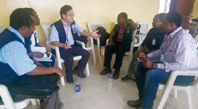Discussing countermeasures to the outbreak with WHO’s coordinators dispatched to Liberia (Margibi County, December 2, 2014)