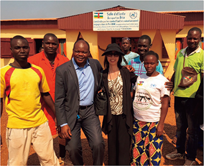 With project staff from the Disarmament, Demobilization, Reintegration (DDR) component of the UN Stabilization Mission in the Central African Republic (MINUSCA) program and ex-combatants in Bria, Central African Republic (the author is in the center)