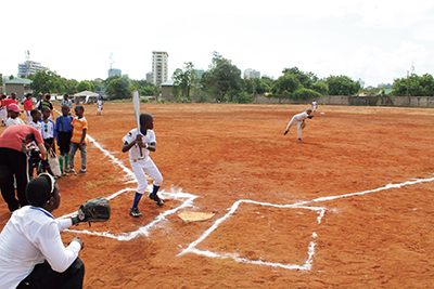 Baseball experience event involving local elementary school students held on a baseball field developed through Grant Assistance for Cultural Grassroots Projects (December 6, Tanzania)