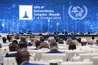 At the Extraordinary Congress of the UPU (left), and the author in the conference hall (right) (October, Riyadh, Saudi Arabia; Photo: UPU)
