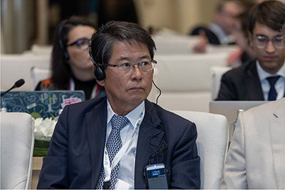 At the Extraordinary Congress of the UPU (left), and the author in the conference hall (right) (October, Riyadh, Saudi Arabia; Photo: UPU)
