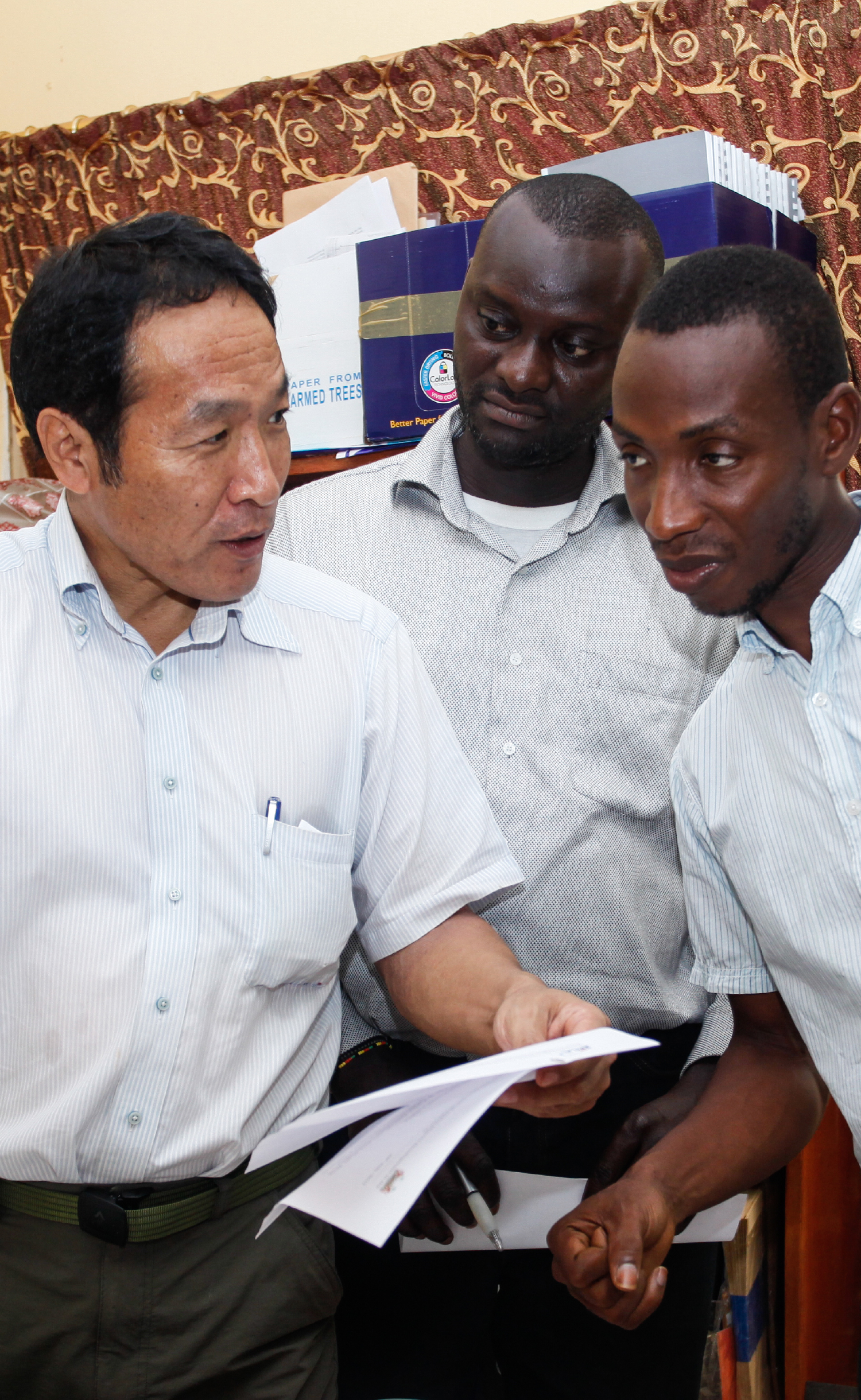 Japanese and African people discussing